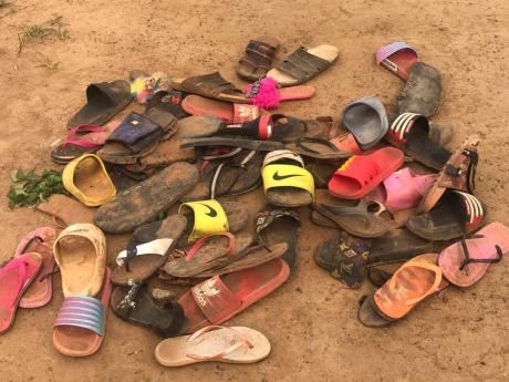 Flip flop sandals belonging to students of Bethel Baptist High School are seen following an attack by gunmen in Damishi Kaduna, Nigeria. 