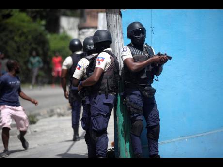 
Police officers patrol in search for suspects in the murder Haiti’s President Jovenel Moïse, in Port-au-Prince, Haiti. Moïse was assassinated in an attack on his private residence early Wednesday. 
