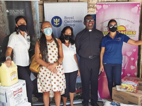 From left: Susanna Valli of Falmouth Cruise Port and Royal Caribbean; Carla Gullotta of Stand Up For Jamaica; Alex Ghisays of Issa Trust Foundation; Father Howard James of Lady of Fatima Catholic Church, Ocho Rios; and Asha Issa of Cool Charities.