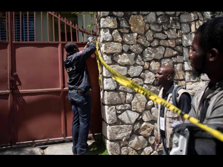 A member of security forces cordons off access to the residence of Haitian President Jovenel Moise, in Port-au-Prince, Haiti, Wednesday, July 7.