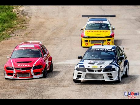 Gary Williams in his Evo leads Andre Anderson and Heath Causwell into Corner three at Dover Raceway.