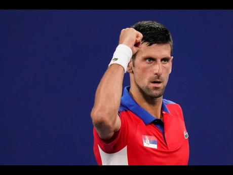 Novak Djokovic, of Serbia, celebrates during a second round tennis match against Jan-Lennard Struff, of Germany, at the 2020 Summer Olympics in Tokyo, Japan on Monday.