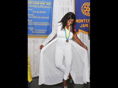 Credit: Ashley Anguin Amber-Gail Grandison, the newly installed president of the Rotary Club of Montego Bay, takes a bow after her official installation into the position during the annual installation ceremony, held at Day-O Plantation Restaurant & Bar on Saturday evening.