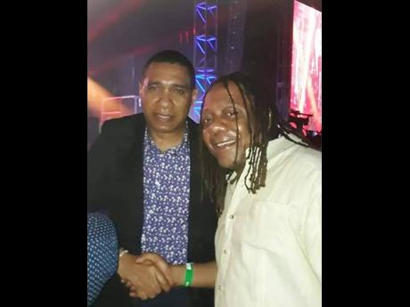 Credit: Contributed Sean ‘Contractor’ Edwards (right) and Prime Minister Andrew Holness at the Air Supply concert at Couples San Souci in May 2019.