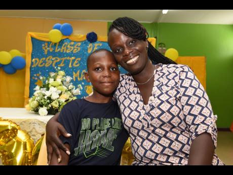 Alechia Anderson-Douglas with her son Jalill Douglas from Yallahs Primary School, St Thomas. Jalill aced PEP  with perfect scores and will be attending Campion College. 
