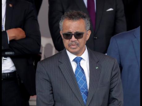 In this file photo dated Tuesday, July 14, 2020, Director General of the World Health Organization, Tedros Adhanom Ghebreyesus, attends the Bastille Day military parade in Paris.  