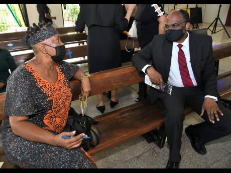 Earl Jarrett (left), chief executive officer, Jamaica National Group speaks with Dr Amina Blackwood-Meeks at Wednesday’s service.