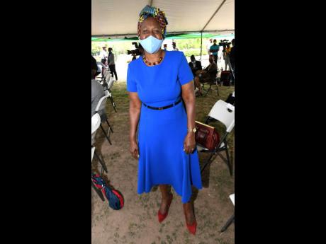 Credit: Rudolph Brown Pastor Claudia Ferguson of the Jamaica Evangelical Alliance, colour blocks in blue and red and ties it all together with a colourful headwrap.