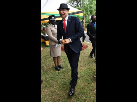 Credit: Rudolph Brown Sir Patrick Allen, governor general of Jamaica, is protected from the elements in a black felt hat.