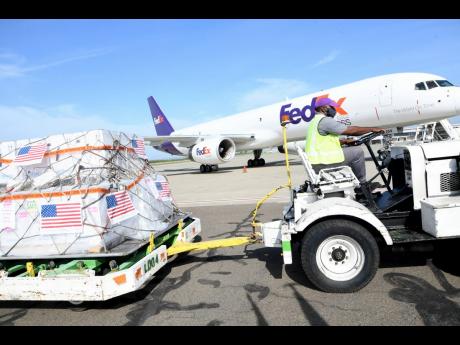 Credit: Rudolph Brown A shipment of the Pfizer vaccines which arrived at the Norman Manley International Airport.