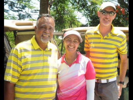The winning team of Sean Morris (left) and Mark Newnham (right) share a happy moment with newly elected Jamaica Golf Association (JGA) president Jodi Munn-Barrow on the third and final day of the JGA Four-Ball Trials at the Caymanas Golf Club in St Catheri