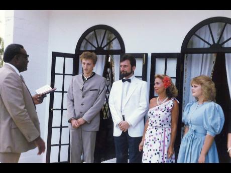 Credit: Contributed The Rev Conrad Pitkin officiates at the wedding of Alfred Vlaschitz (centre) and wife Renate, alongside two witnesses, at their wedding ceremony 35 years ago at Half Moon in Montego Bay.