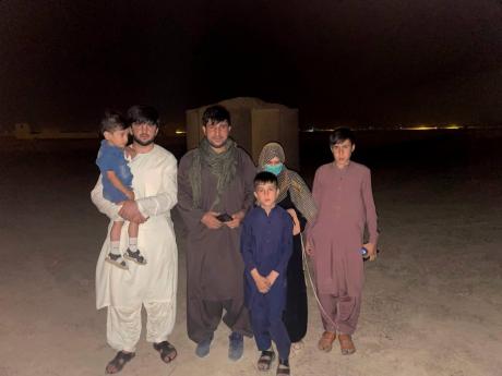 In this photo provided to The Associated Press, Mohammad Khalid Wardak is seen in Afghanistan on Wednesday, August 18, 2021, after the US military and its allies rescued him and his family. Wardak, a high-profile Afghan national police officer, was being h