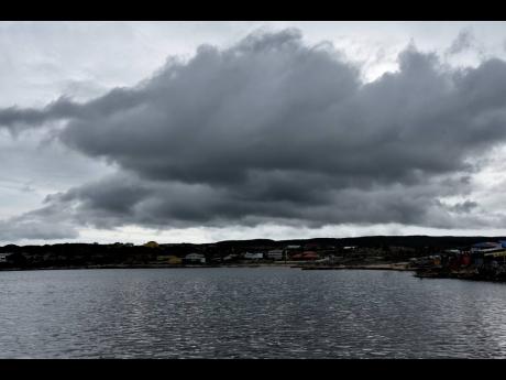 Dark clouds gather over Hellshire during the passage of Tropical Storm Grace on Tuesday.