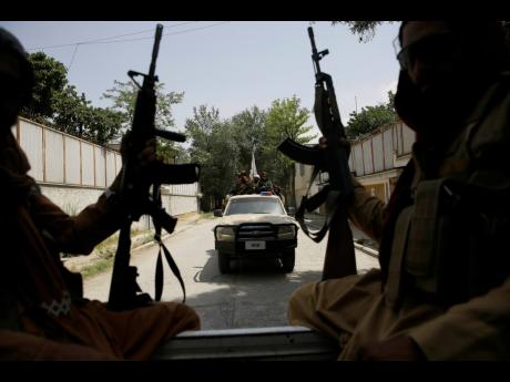 Taliban fighters patrol in Kabul, Afghanistan. After the Taliban takeover, employees of the collapsed government, civil society activists and women are among the at-risk Afghans who have gone into hiding or are staying off the streets.