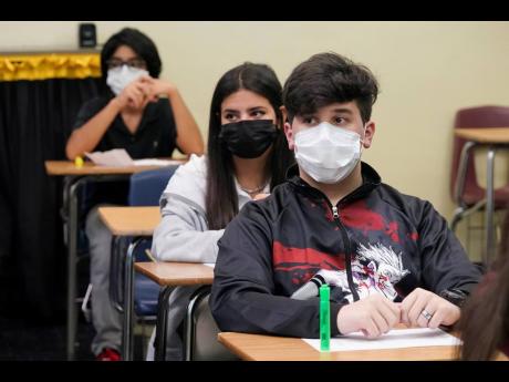 Students sit in an algebra class at Barbara Coleman Senior High School on the first day of school in Miami Lakes, Florida. A judge has ruled that Florida school districts may impose mask mandates.