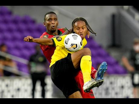 
Reggae Boyz  forward Bobby Reid (front).
