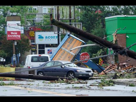 Debris is strewn along West Street in Annapolis, Maryland, Wednesday, Sept 1, 2021, after severe weather moved through the area. 