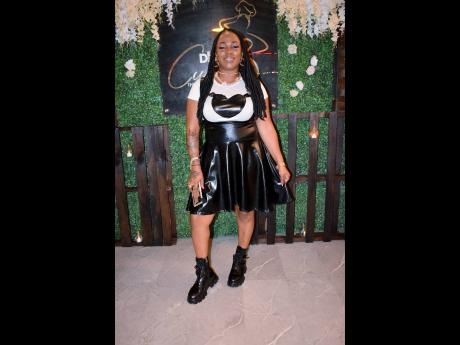 Dressed in combat boots, DJ Naz Gurlpower supports her long-time friend on her new achievement. 
