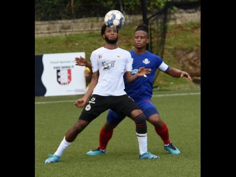 Ian Allen
Shaniel Thomas (left) of Cavalier controls the ball while under pressure from Damono Solomon of  Portmore United during their Jamaica Premier League match on Friday at the UWI-JFF Captain Horace Burrell Centre of Excellence. Cavalier won 1-0.