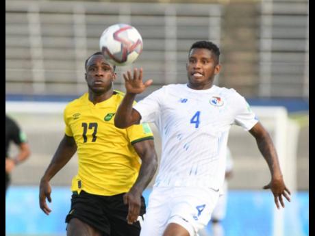 Jamaica's Michail Antonio (left) challenges Panama's Fidel Escobar for the ball during their FIFA World Cup Qualifying match at the National Stadium in Kingston on Sunday.