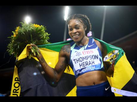 Elaine Thompson Herah celebrates after winning the women’s 100 metres race during the Weltklasse IAAF Diamond League international athletics meeting at the Letzigrund stadium in Zuerich, Switzerland, yesterday. Thompson Herah clocked 10.65 seconds. 