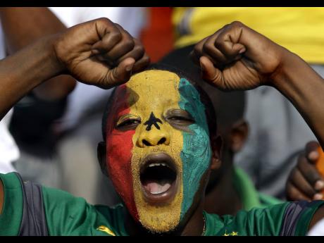 In this 2015 file photo Senegal soccer fan gestures during the African Cup of Nations between Ghana and Senegal. Caribbean countries, like Jamaica, can learn much from Ghana especially since there is a push to establish STEM schools islandwide. An importan