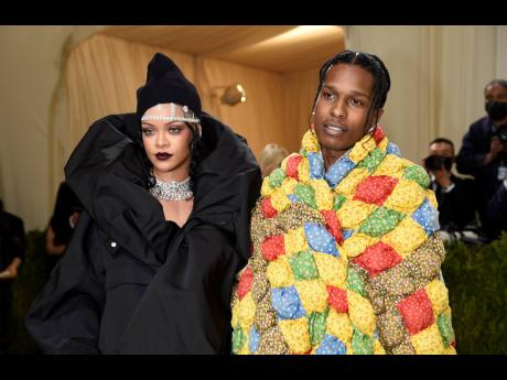 Rihanna (left), ever the Met Gala queen, wore a huge black Balenciaga look and hat accompanied by A$AP Rocky in a multicoloured quilted coat from ERL. She wore over 267 carats of Bulgari diamonds, including two choker necklaces.
