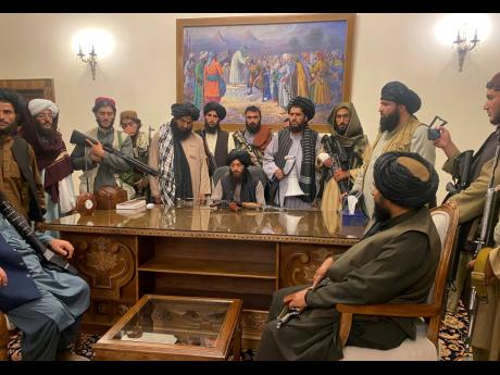 Taliban fighters take control of Afghan presidential palace in Kabul, Afghanistan, after President Ashraf Ghani fled the country on August 15.