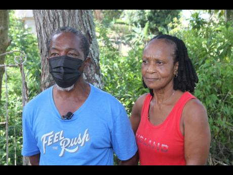 Herbert Freckleton, cousin of Antonette Wemyss-Gorman, talks about the army woman’s early beginnings in Top Alston, Clarendon. Beside him is his wife Sharon. 