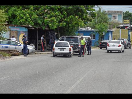 Security forces conducting spot check on Maxfield Avenue on no movement day, September 14.