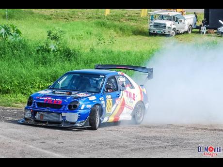 That’s only tyre smoke from Victor Handall’s Subaru ,as he locks up the brakes approaching the Hairpin at Dover.