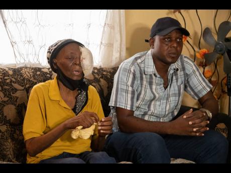 A teary-eyed Roger Foster looks on as his mother, Yvonne Ewers, talks about her battle with lymphoma, which has resulted in a swelling to her face.