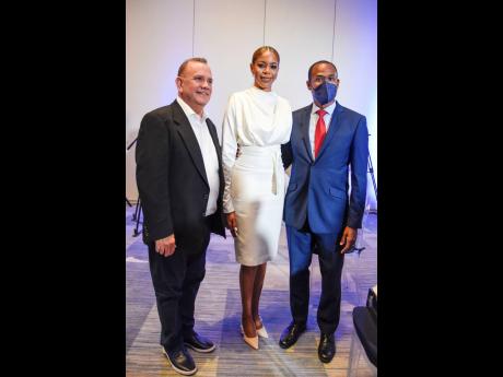 From left: Francisco Angulo of Realogy; Julian Dixon, co-owner of Sotheby’s International Realty Jamaica; and Dr Nigel Clarke, minister of finance and the public service, pause their conversation for a quick photo op. 