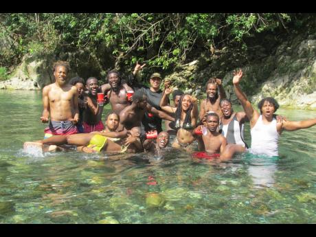 Credit: Photo by Paul H. Williams Captain Quao and his people moved from the hills to settle in Crawford Town, Portland, and then to Charles Town in the said parish. Here, Charles Town Maroons are having a party with some American students in the Spanish River, site of the final battle bet