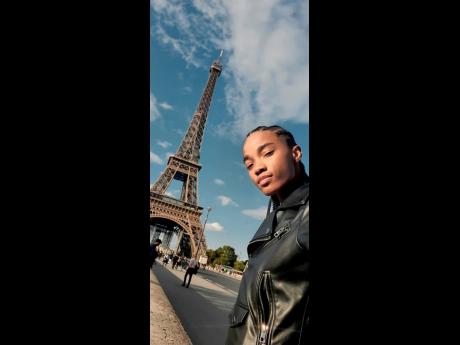 Shantae Leslie checks out the Eiffel Tower in Paris after walking for Raf Simmons, Loewe and Valentino. 
