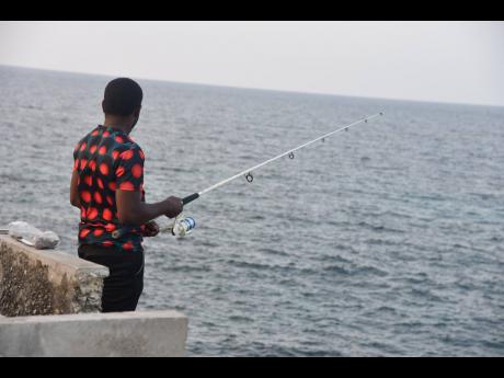 A man fishing by Fort Charlotte in Lucea, Hanover, last week.