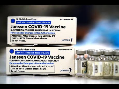 In this March 6, 2021 photo, boxes containing the Johnson & Johnson COVID-19 vaccine sit next to vials in the pharmacy of National Jewish Hospital for distribution, in east Denver.