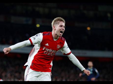 
Arsenal’s Emile Smith Rowe celebrates after scoring his side’s third goal during the English Premier League match between Arsenal and Aston Villa at the Emirates stadium in London yesterday.