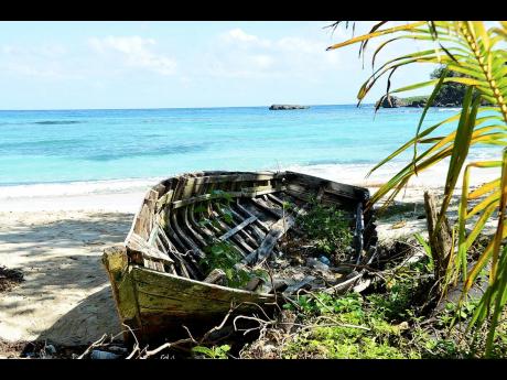 In this file photo, an abandoned boat is seen at Winnifred Beach, Portland. It is claimed that belonged to a group of Haitians. 