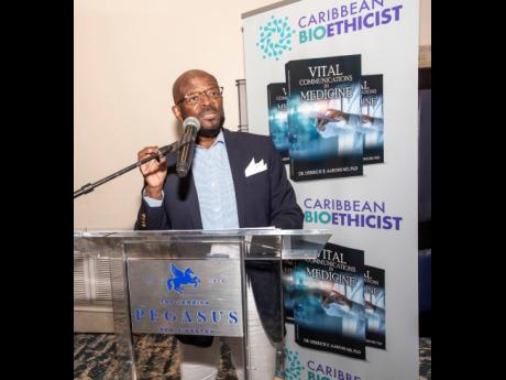 
The doctor and author making a presentation on his recently staged book launch held at the Jamaica Pegasus Hotel.