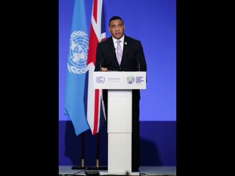 Prime Minister Andrew Holness delivering an address during the COP26 Summit in Glasgow, Scotland, on Monday.
