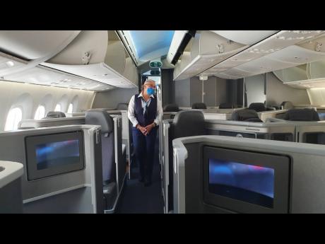 A lead stewardess gives a tour of one of the American Airlines Boeing Dreamliners.