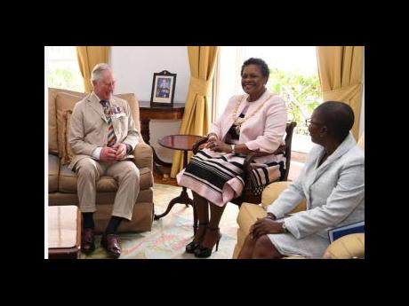Britain’s Prince Charles attends a meeting with Governor General Dame Sandra Mason (centre), during a visit to Barbados in 2019.