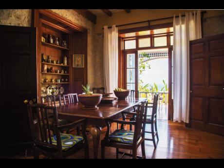 The formal dining room facing the sea, features a custom-built display.