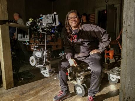 Photographer David Lee, brother of film-maker Spike Lee, appears on the set of the series ‘Godfather of Harlem’. A new photography book spanning Spike’s career brings together images shot by David, from the making of ‘Do the Right Thing’ to ‘Da