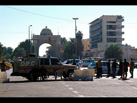 Iraqi security forces close the heavily fortified Green Zone as they tightened security measures, hours after the assassination attempt on Prime Minister Mustafa al-Kadhimi in Baghdad.