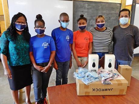 From left: Sherron Minott, principal, Breadnut Hill Primary School; Ayanna Williams, head girl; Michael Rubie, head boy; Okavis Donaldson, student; Shaneika McFarlane, teacher; and Larry Thakurani. 