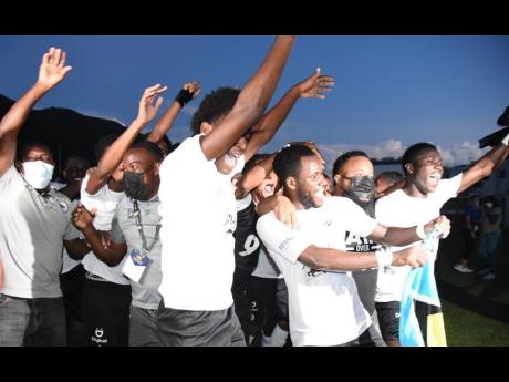 Members of the Cavalier Soccer Club football team celebrate after their penalty shoot-out win over Waterhouse in the Jamaica Premier League final at the UWI-JFF Captain Horace Burrell Centre of Excellence.