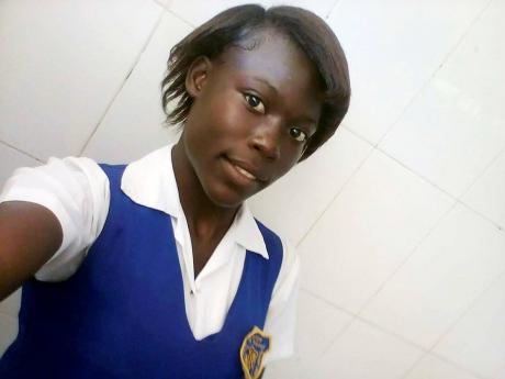 Yashieken Campbell, 19, has dropped out of school to sell in the market to support her family.